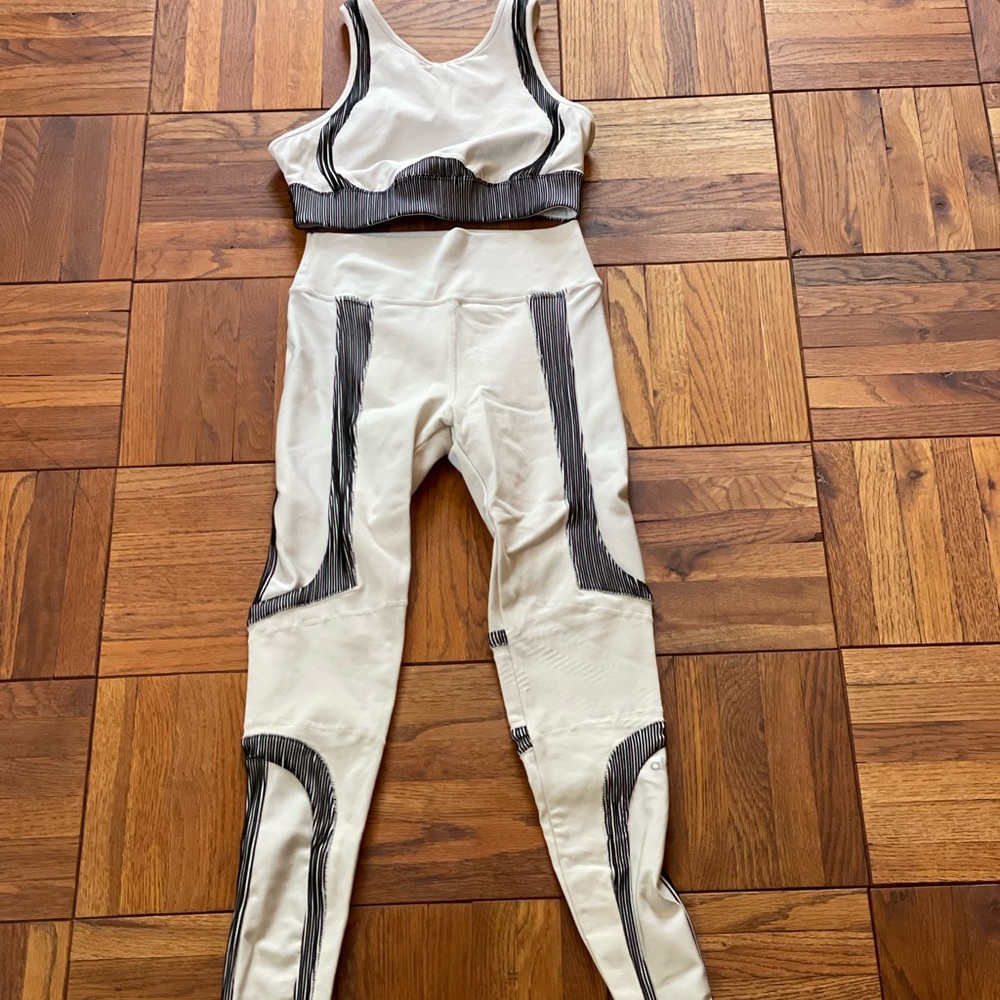ALO Electric workout set in cream and black.